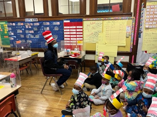 DLEACS student reads to class